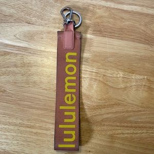Coral/yellow LULULEMON keychain
